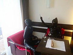In Latex Covered Couple Enjoys A Good Drink