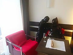 In Latex Covered Couple Enjoys A Good Drink