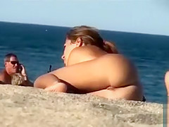 Lesbian girls sunbathe with their natural tits out