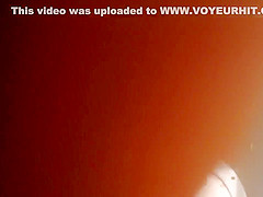 Luscious beauty in a colorful dress has her crotch filmed