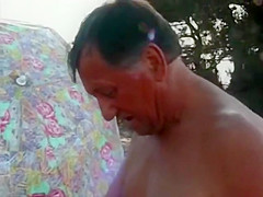 Mature threesome at the beach