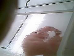 Milf taking shower in shower cabin