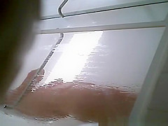 Milf taking shower in shower cabin
