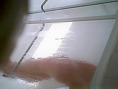 Milf taking shower in shower cabin