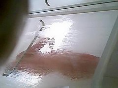 Milf taking shower in shower cabin