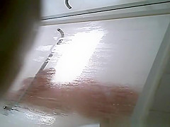 Milf taking shower in shower cabin