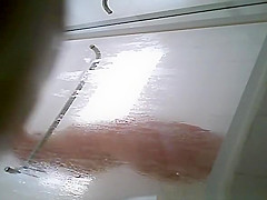 Milf taking shower in shower cabin