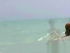Naked and showing everything at the nude beach