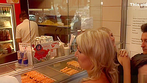 Naked blonde in line at fast food shop