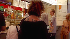 Naked blonde in line at fast food shop