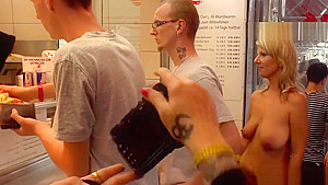 Naked blonde in line at fast food shop