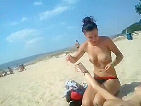 Naked lesbians licking each other on the beach