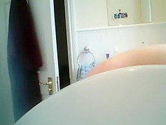 Naked wife with big boobs spied in bathroom
