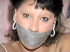 Native American model Trish tape gagged and tied up