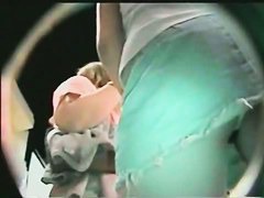 Nighttime video of bare asses under light summer skirts