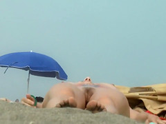 Nudist hairy pussy filmed at the beach