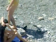 Outdoor of blowjob on public beach with nude couple