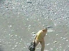 Outdoor of blowjob on public beach with nude couple