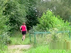 Peeing babes empty their bladders in a park
