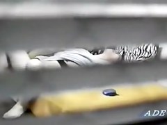Peeping window movie in which an asian whore masturbates