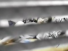 Peeping window movie in which an asian whore masturbates