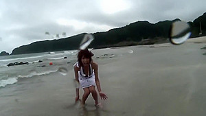 Randy brunette sucks guy's pole on the beach