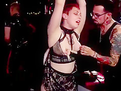 Redhead and ebony fucked at bdsm orgy