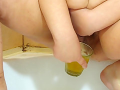 Russian Girl Pissing Into A Glass And Pours Herself Urine