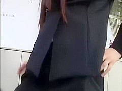 Sexy Japanese female boss in nylon stockings gives her employee a great footjob at the office