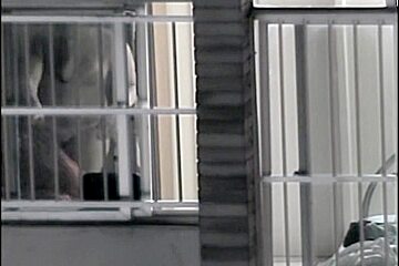 Sexy naked neighbor is staying in front of the open window