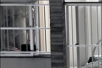 Sexy naked neighbor is staying in front of the open window