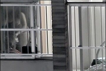 Sexy naked neighbor is staying in front of the open window
