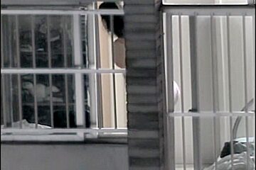 Sexy naked neighbor is staying in front of the open window