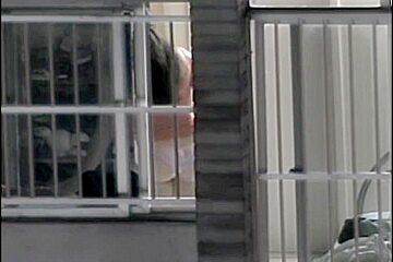 Sexy naked neighbor is staying in front of the open window