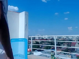 Sexy skinny girl on roof