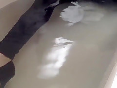 Sexy tight pants ankle boots and heels in bath