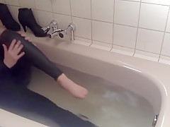 Sexy tight pants ankle boots and heels in bath
