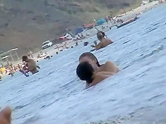 Sexy topless babe in a thong bikini