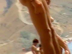Sexy topless babe in a thong bikini