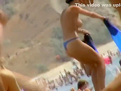 Sexy topless babe in a thong bikini