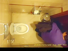 Short hair mature woman taking a pee