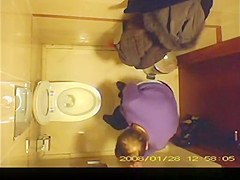 Short hair mature woman taking a pee
