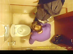 Short hair mature woman taking a pee