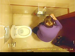 Short hair mature woman taking a pee
