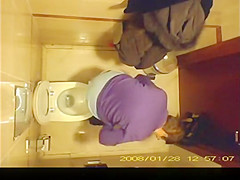 Short hair mature woman taking a pee