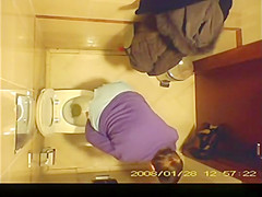 Short hair mature woman taking a pee