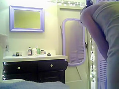 Small boobs chick with purple hair undressing in bathroom