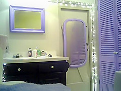 Small boobs chick with purple hair undressing in bathroom