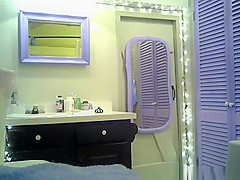 Small boobs chick with purple hair undressing in bathroom
