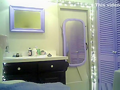 Small boobs chick with purple hair undressing in bathroom